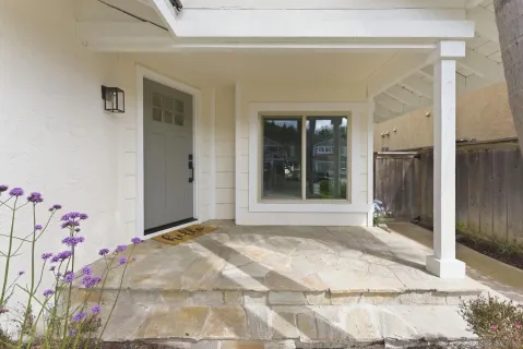 a view of a door in front of a house