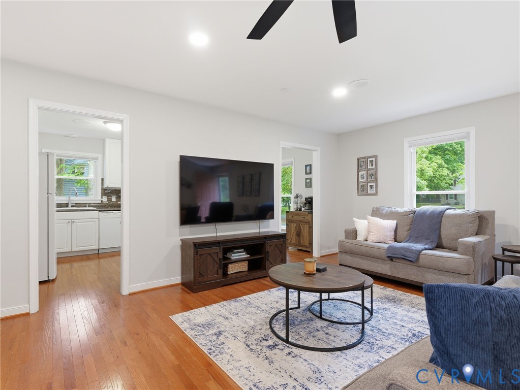 7707 Woodbrook Road Quinton, VA 23141 - Photo 9 of 42 Spacious living area featuring wood-finish floorin
