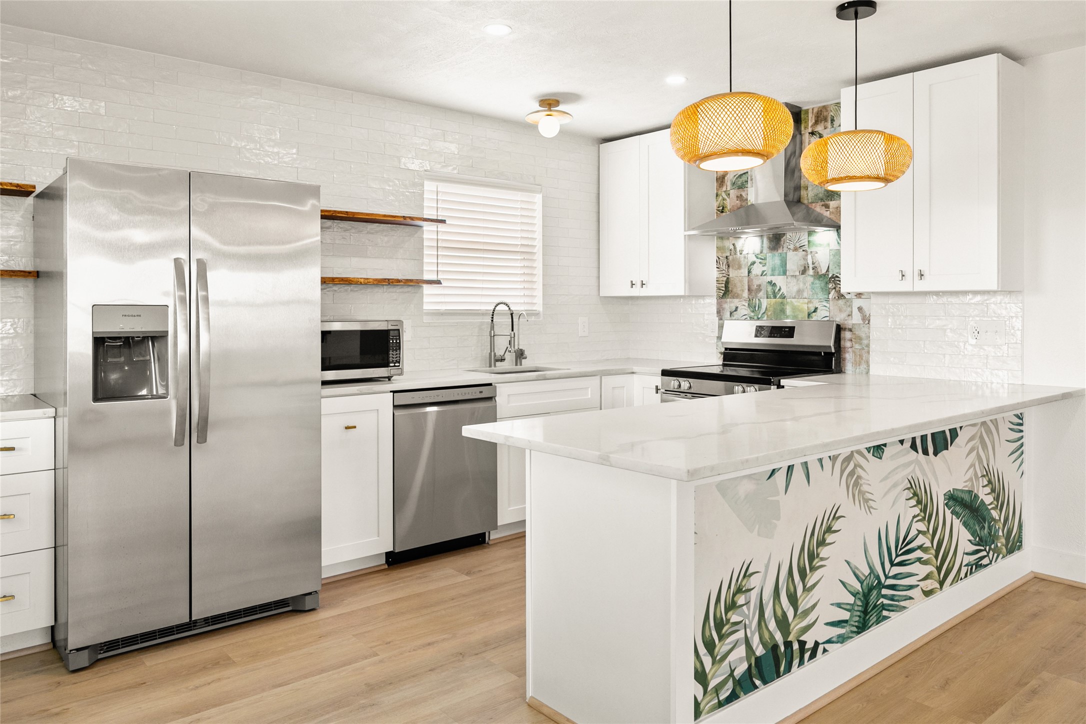 715 Caisson Street Surfside Beach, TX 77541 - Photo 4 of 35 This stylish kitchen is open to the living area, drink fridge, stainless appliance, open wood shelves with live edge, and seating at the bar for 4.