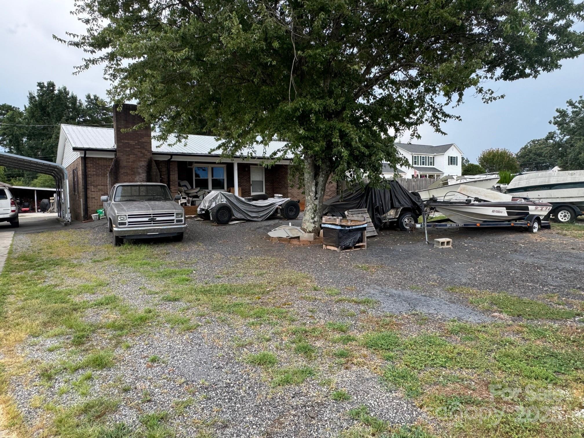 a view of a patio with table and chairs and a fire pit