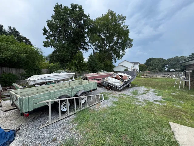 a view of a wooden deck and lake view