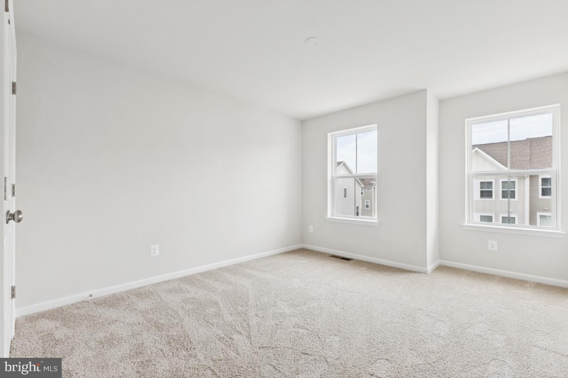 9656 Killenney Place Waldorf, MD 20601 - Photo 16 of 25 an empty room with windows and closet
