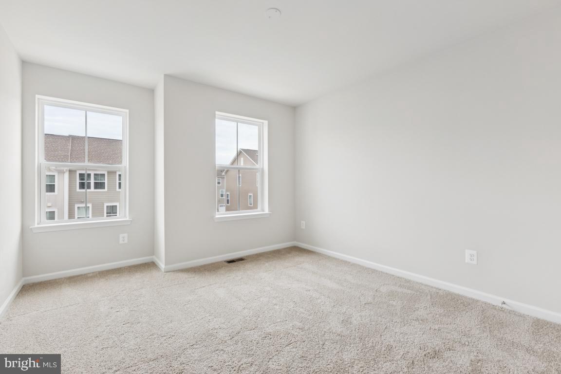 9656 Killenney Place Waldorf, MD 20601 - Photo 18 of 25 an empty room with windows