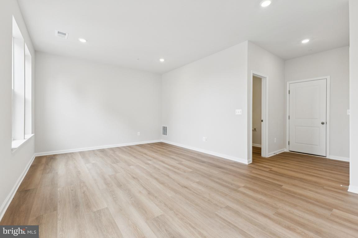 9656 Killenney Place Waldorf, MD 20601 - Photo 20 of 25 wooden floor in an empty room with a window