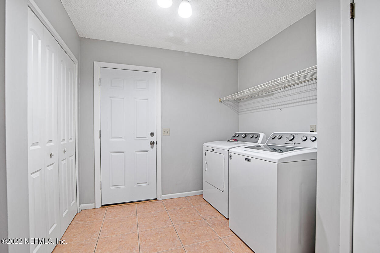 3759 Rustic Lane Jacksonville, FL 32217 - Photo 12 of 32 a view of utility room with washer and dryer
