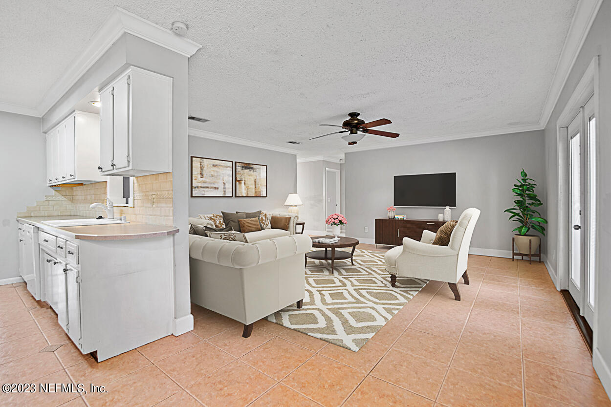 3759 Rustic Lane Jacksonville, FL 32217 - Photo 13 of 32 a living room with furniture a flat screen tv and a window