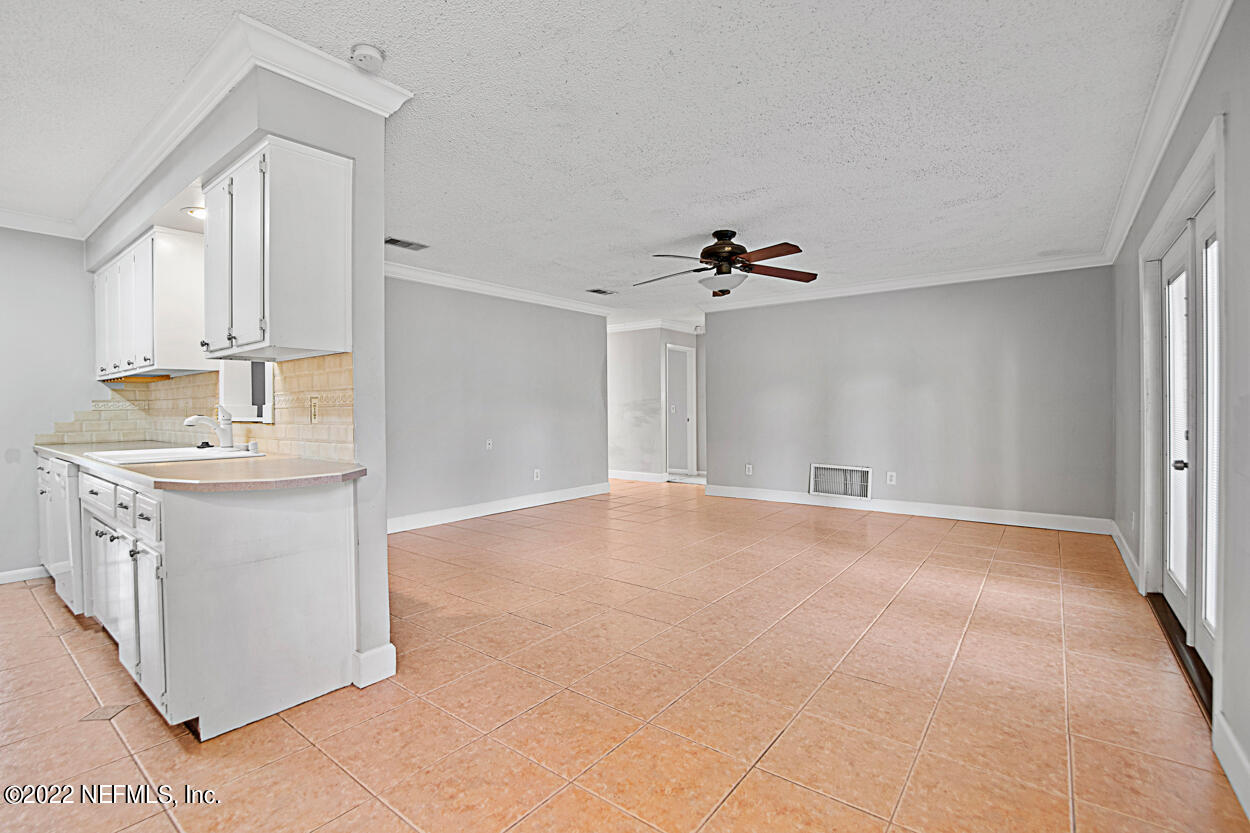 3759 Rustic Lane Jacksonville, FL 32217 - Photo 14 of 32 a view of empty room with cabinet and ceiling fan
