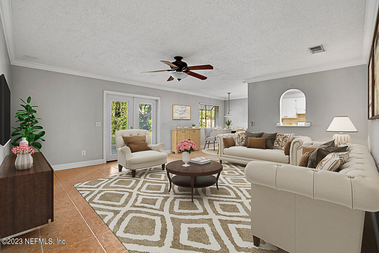 3759 Rustic Lane Jacksonville, FL 32217 - Photo 17 of 32 a living room with furniture a chandelier and a rug