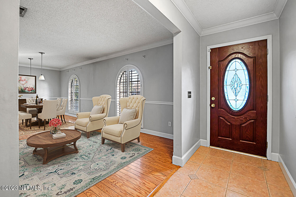 3759 Rustic Lane Jacksonville, FL 32217 - Photo 2 of 32 a living room with furniture a rug and a window