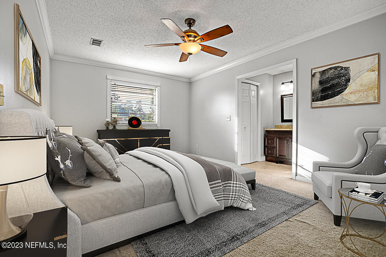 3759 Rustic Lane Jacksonville, FL 32217 - Photo 23 of 32 a living room with bed furniture and a window