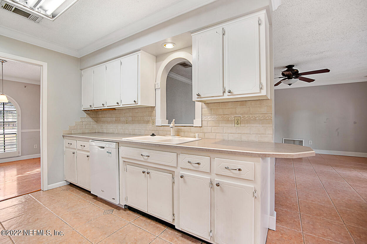 3759 Rustic Lane Jacksonville, FL 32217 - Photo 9 of 32 a view of granite countertop white cabinets with wooden floor
