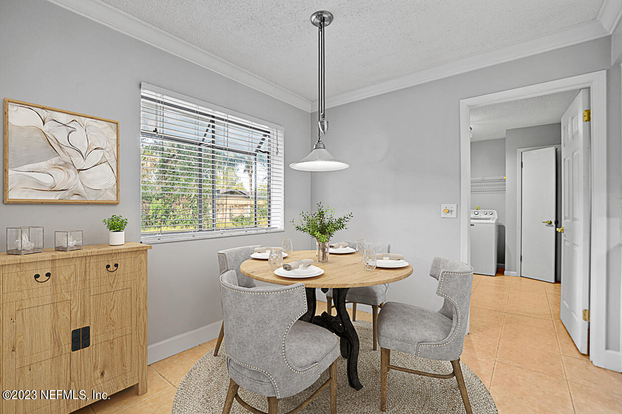 3759 Rustic Lane Jacksonville, FL 32217 - Photo 10 of 32 a view of a dining room with furniture window and wooden floor