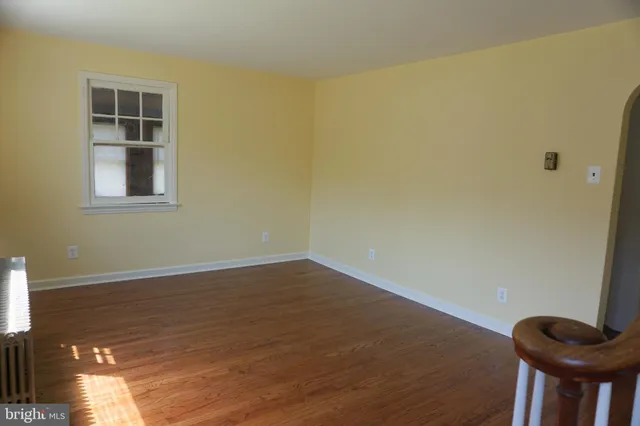 a view of a livingroom with furniture and wooden floor