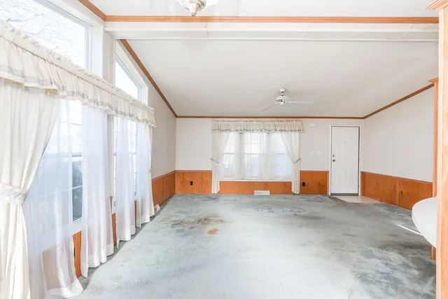 wooden floor to ceiling window and an empty room