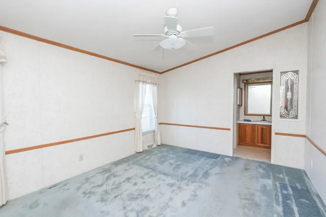 a bathroom with a granite countertop sink toilet a mirror and shower
