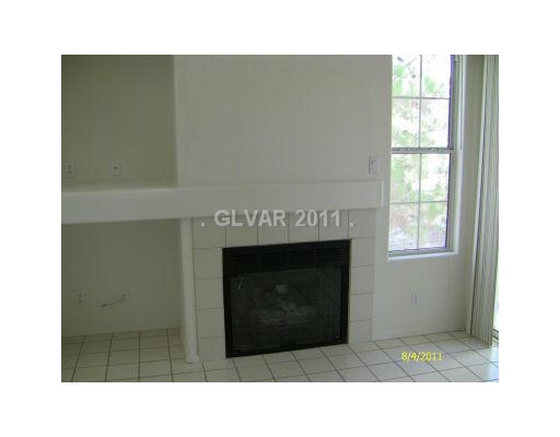 2201 Ramsgate Drive, Unit 128 Henderson, NV 89074 - Photo 3 of 20 Living Room. FIREPLACE IN THE LIVING ROOM