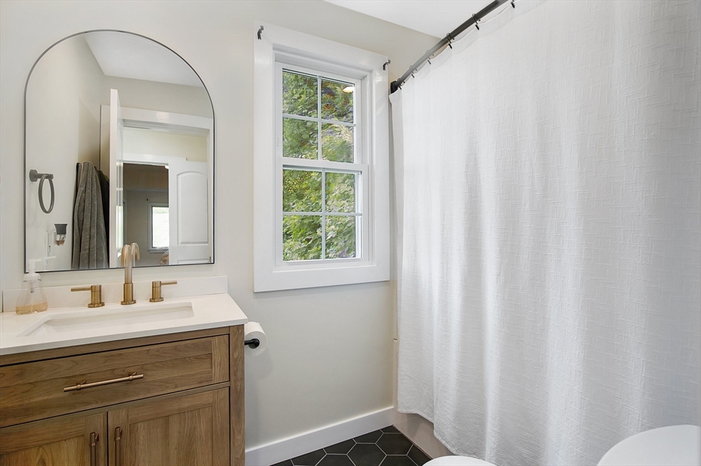 123 Stebbins Road Monson, MA 01057 - Photo 22 of 42 a bathroom with a sink and a mirror
