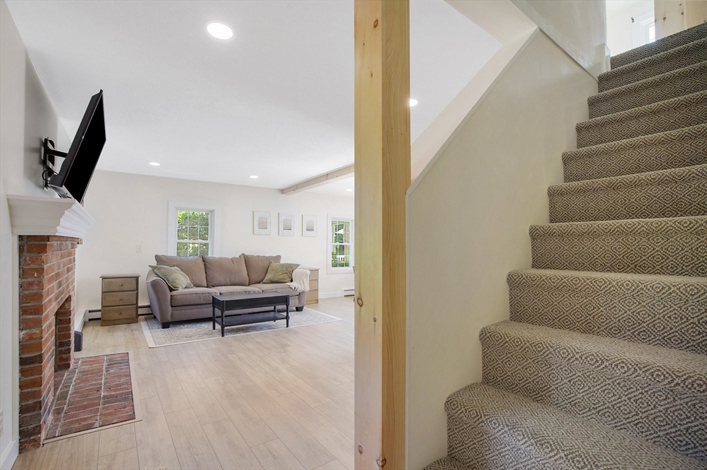 123 Stebbins Road Monson, MA 01057 - Photo 24 of 42 a living room with furniture and a flat screen tv