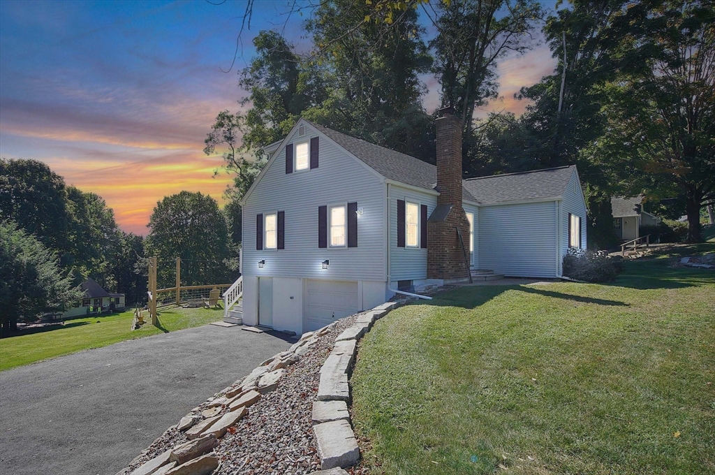 123 Stebbins Road Monson, MA 01057 - Photo 30 of 42 a front view of a house with a yard and garage