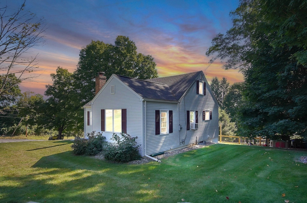 123 Stebbins Road Monson, MA 01057 - Photo 31 of 42 a front view of a house with a garden and yard