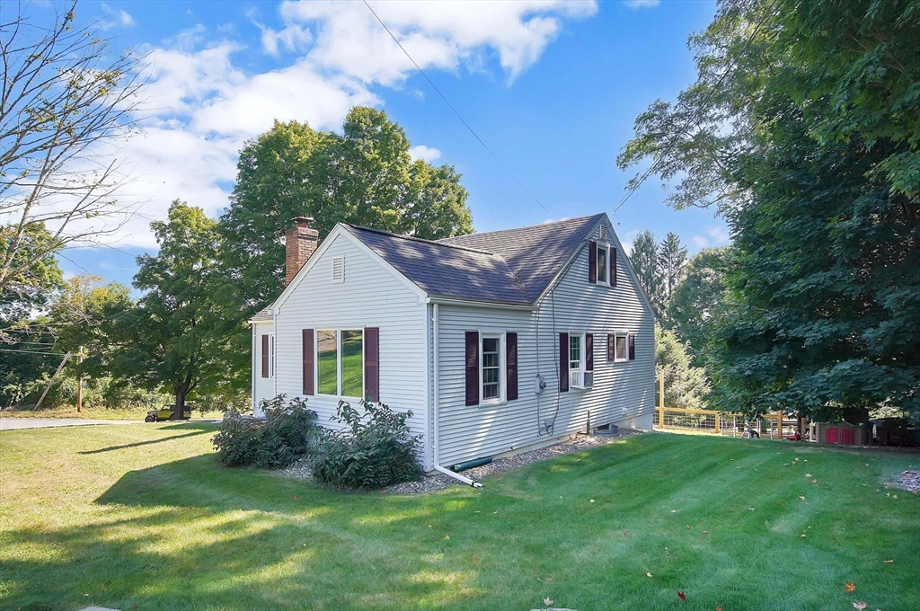 123 Stebbins Road Monson, MA 01057 - Photo 34 of 42 a front view of house with yard and green space
