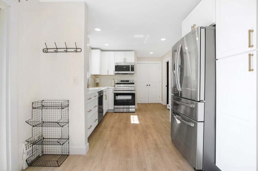 123 Stebbins Road Monson, MA 01057 - Photo 5 of 42 a kitchen with stainless steel appliances a refrigerator and a stove top oven