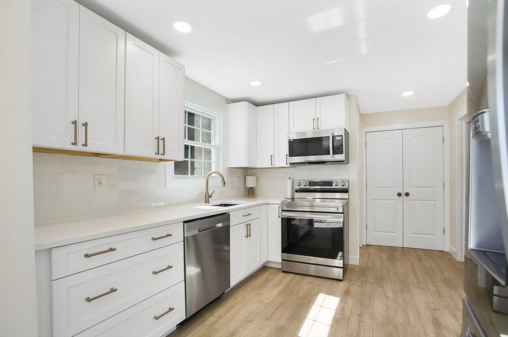 123 Stebbins Road Monson, MA 01057 - Photo 7 of 42 a kitchen with stainless steel appliances granite countertop a stove a sink and a refrigerator