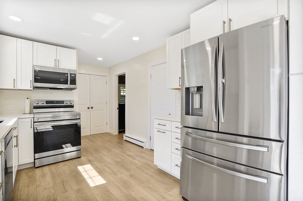 123 Stebbins Road Monson, MA 01057 - Photo 8 of 42 a kitchen with stainless steel appliances a refrigerator stove and microwave