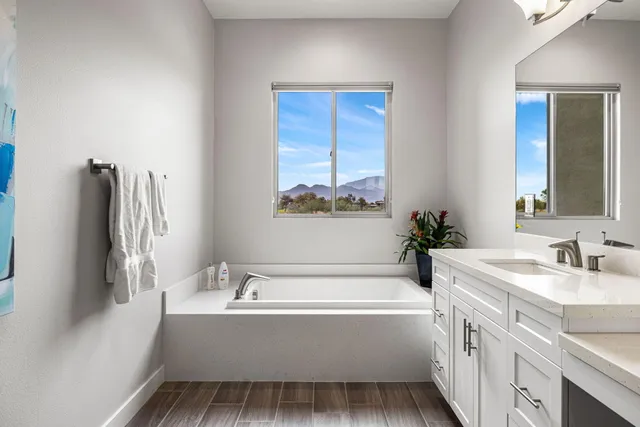 a bathroom with a bathtub and a sink