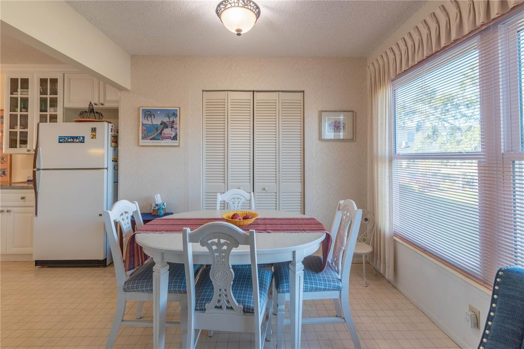 2310 Denmark Street, Unit 46 Clearwater, FL 33763 - Photo 14 of 44 a dining room with furniture and window