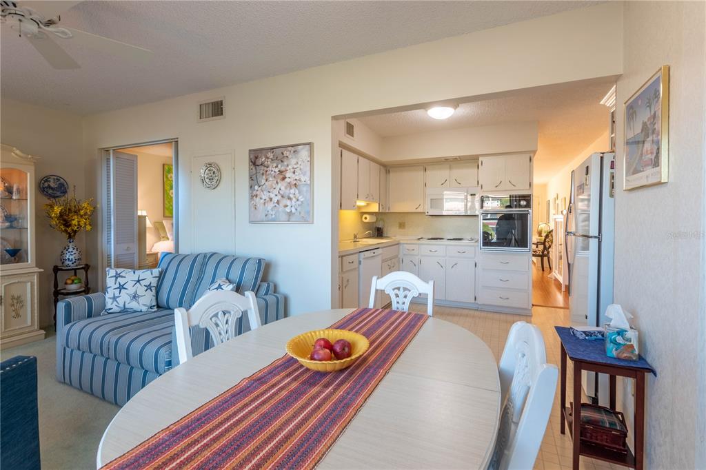 2310 Denmark Street, Unit 46 Clearwater, FL 33763 - Photo 15 of 44 a living room with furniture and a kitchen view