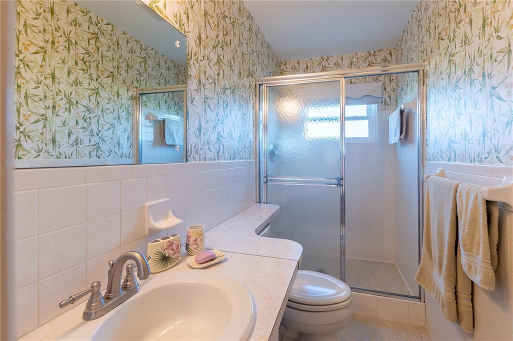 2310 Denmark Street, Unit 46 Clearwater, FL 33763 - Photo 19 of 44 a bathroom with a sink toilet and shower