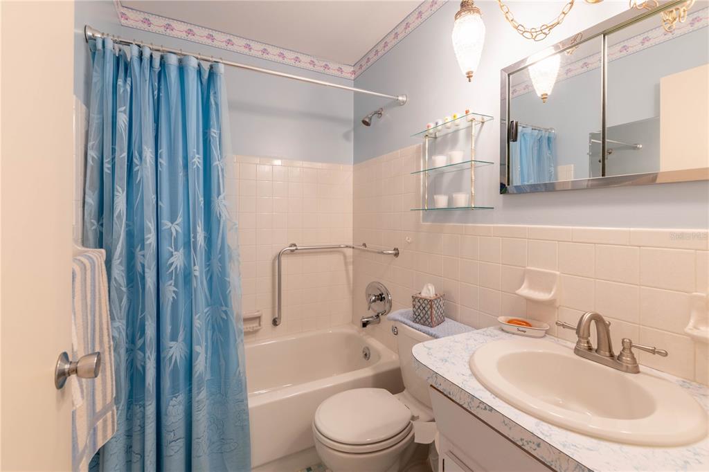2310 Denmark Street, Unit 46 Clearwater, FL 33763 - Photo 22 of 44 a bathroom with a sink toilet and shower