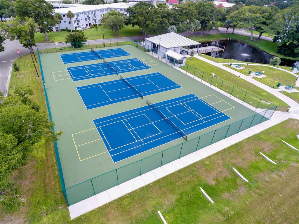 2310 Denmark Street, Unit 46 Clearwater, FL 33763 - Photo 36 of 44 a aerial view of a tennis ground with large trees