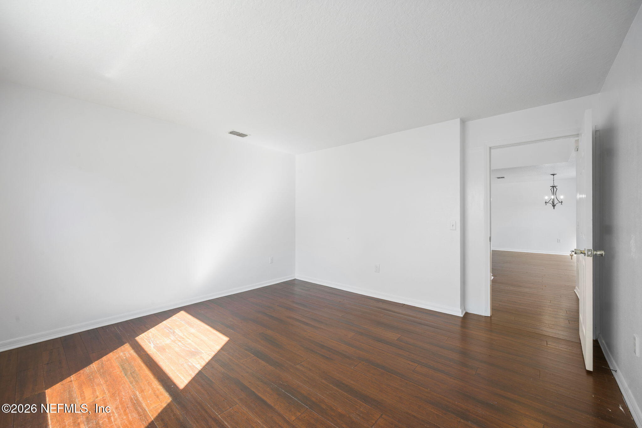 5470 Turkey Creek Road Jacksonville, FL 32244 - Photo 21 of 49 a view of an empty room and wooden floor