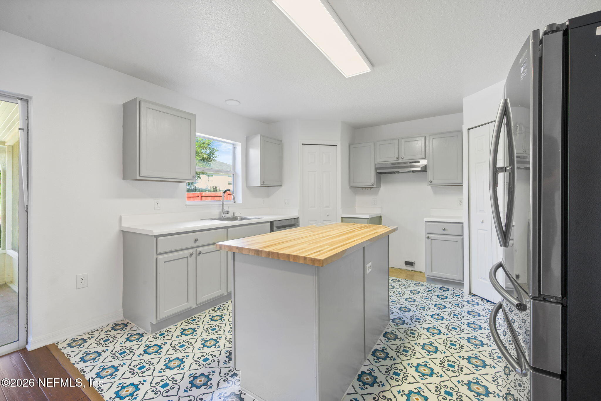 5470 Turkey Creek Road Jacksonville, FL 32244 - Photo 28 of 49 a kitchen with stainless steel appliances granite countertop a sink stove and refrigerator