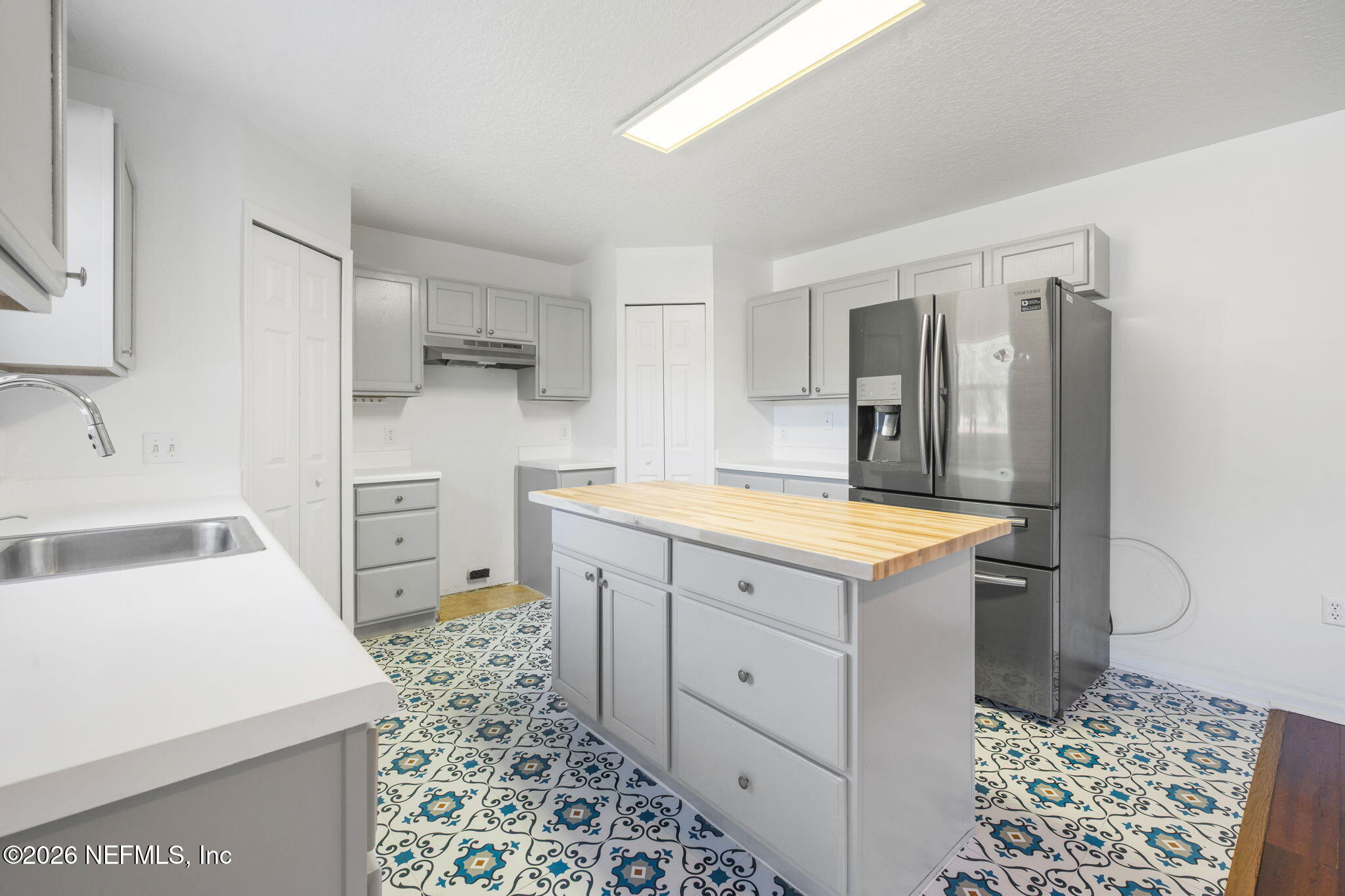 5470 Turkey Creek Road Jacksonville, FL 32244 - Photo 29 of 49 a kitchen with a sink stove and refrigerator