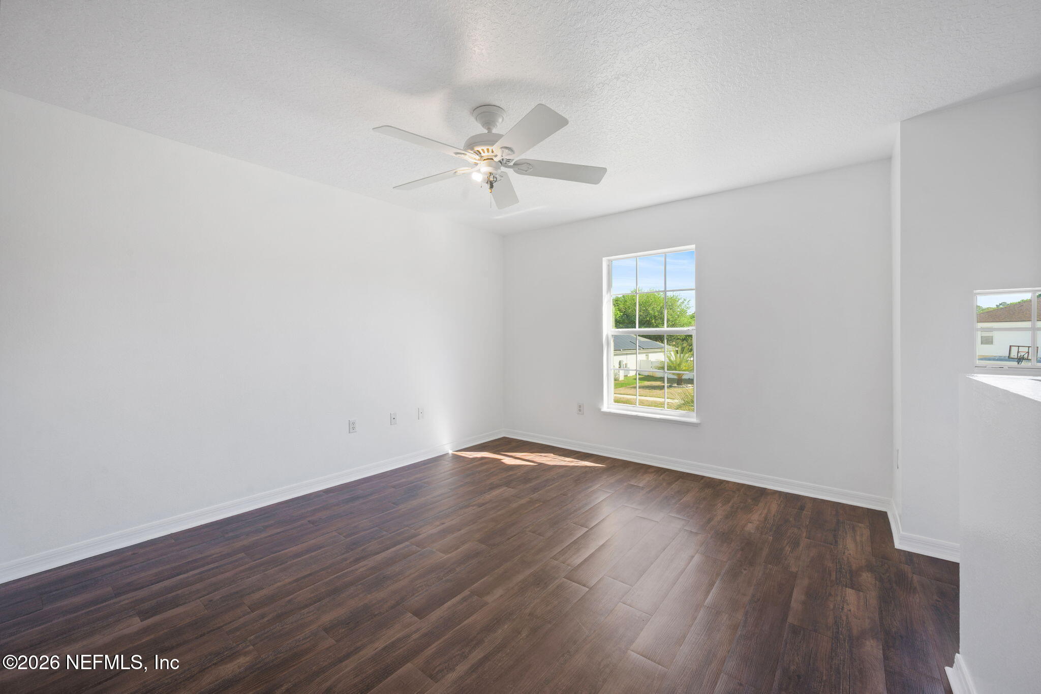5470 Turkey Creek Road Jacksonville, FL 32244 - Photo 38 of 49 wooden floor in an empty room with a window