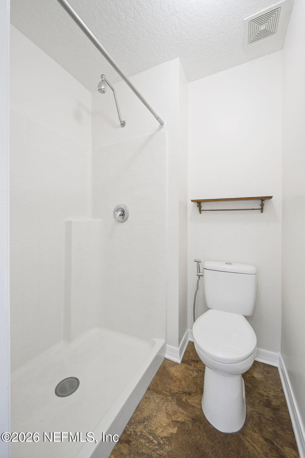 5470 Turkey Creek Road Jacksonville, FL 32244 - Photo 49 of 49 a bathroom with a toilet and a shower