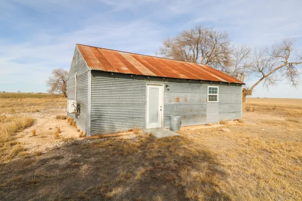 a backyard of house with garden