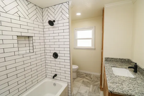 a bathroom with a sink and mirror