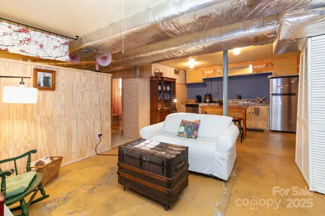 a bathroom with a sink and mirror with toilet