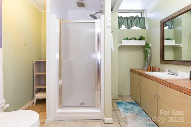 a bedroom with a bed and a table