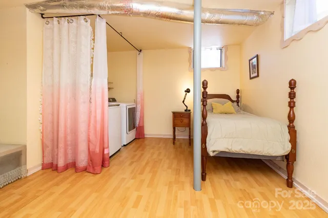 a bedroom with furniture and a window