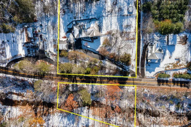a view of a backyard with iron fence