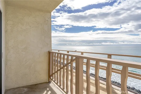 a view of a balcony with an outdoor space