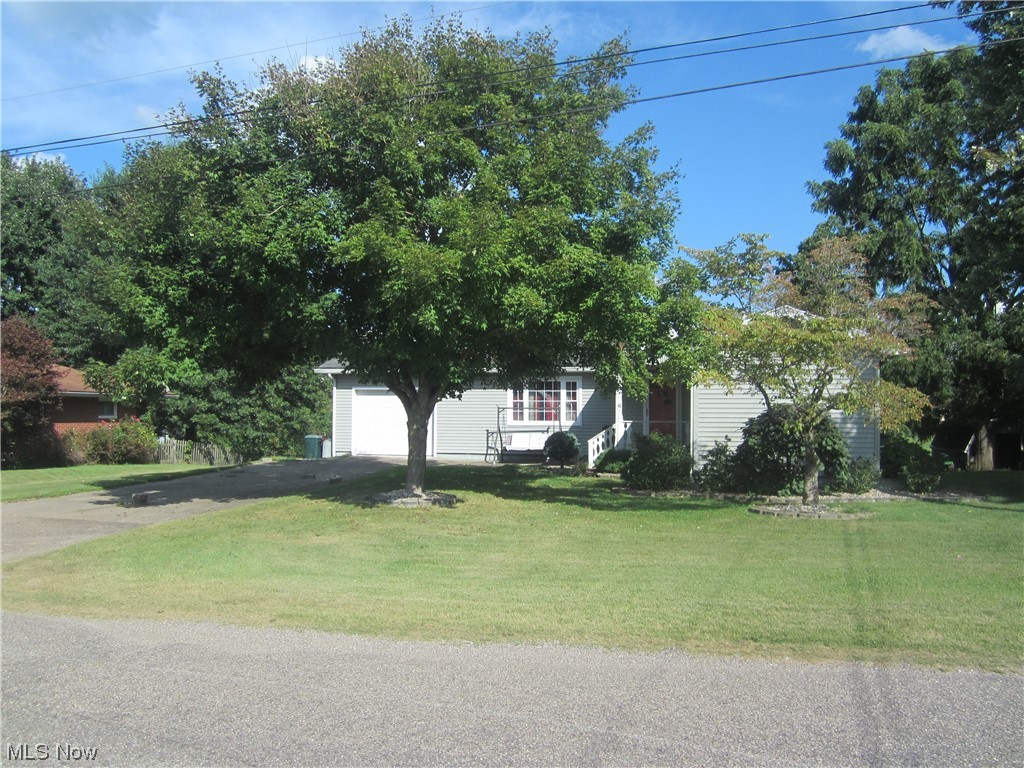 200 Summit Road Marietta, OH 45750 - Photo 3 of 35 View of property hidden behind natural elements with a front lawn