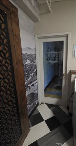 a room with a stove and a refrigerator