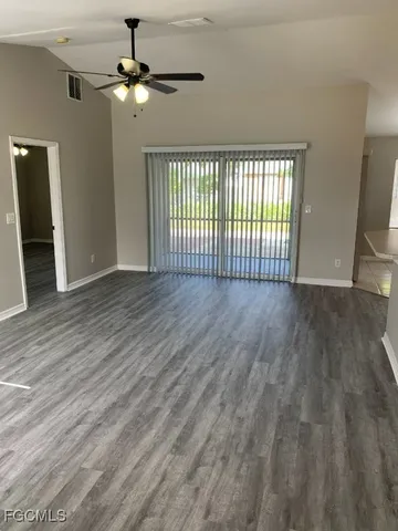 a kitchen with stainless steel appliances a refrigerator sink and microwave