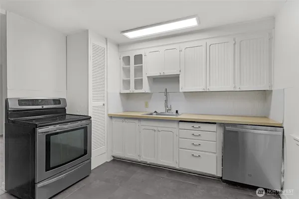 a view of kitchen island with furniture and wooden floor